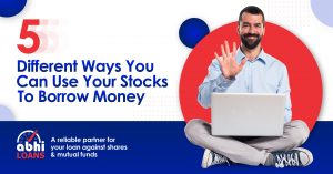 Man sit with laptop 5 Different Ways You Can Use Your Stocks to Borrow Money